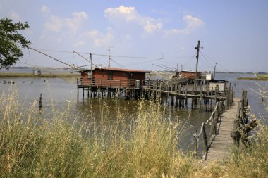 Po river (FE),  Italy - April 30, 2017: An old Fisherman's house on Po river, Delta Regional Park, Emilia Romagna, Italy