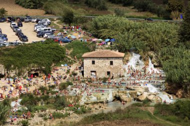 Saturnia (GR), Italy - June 12, 2017: Cascate del Mulino and thermal waters, Mill waterfalls, Saturnia, Grosseto, Tuscany, Italy