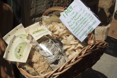 Pitigliano (GR), Italy - June 12, 2017: A delicatessen in a shop in the historic hilltop village in Pitigliano, Grosseto, Tuscany, Italy