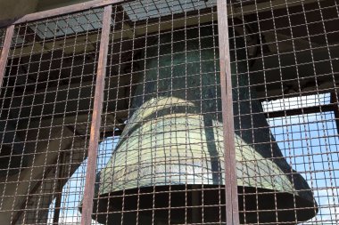 San Gimignano (SI), Italy - April 10, 2017: Bronze bell on San Gimignano tower, Siena, Tuscany, Italy