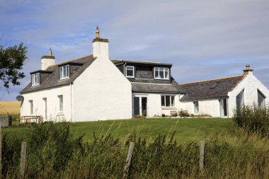 Crawton Bay (Scotland), UK - August 01, 2018: The houses near Crawton Bay, Scotland, Highlands, United Kingdom.