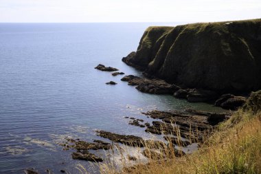 Stonehaven (Scotland), UK - August 01, 2018: Cliffs near Dunnottar castle, Scotland, Highlands, United Kingdom