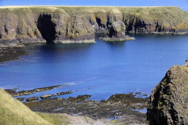 Stonehaven (Scotland), UK - August 01, 2018: Cliffs near Dunnottar castle, Scotland, Highlands, United Kingdom
