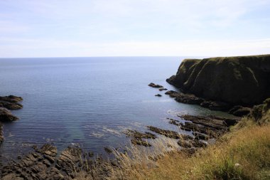 Stonehaven (Scotland), UK - August 01, 2018: Cliffs near Dunnottar castle, Scotland, Highlands, United Kingdom