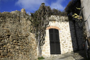 Cervo (IM), Italy - December 30, 2017: A tipycal road and houses in Cervo village, Italian Riviera, Imperia, Liguria, Italy