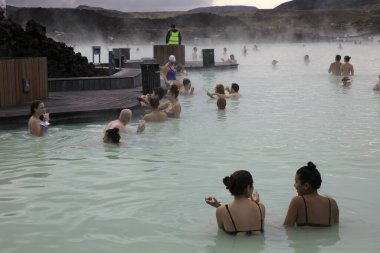 Grindavik / Iceland - August 15, 2017: Tourist relaxing in hot water at blue lagoon, Reykjavik, Iceland, Europe