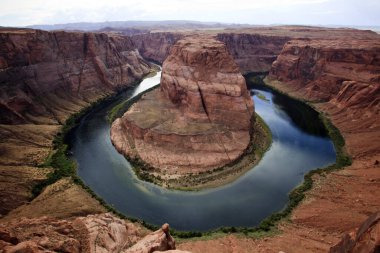 Page, Arizona / USA - August 05, 2015: Horseshoe Bend seen from the lookout point, Colorado river, Page, Arizona, USA