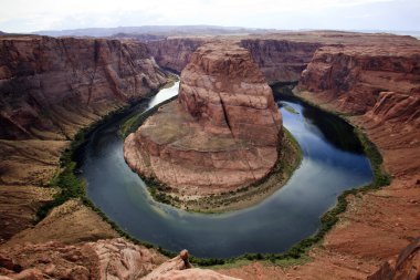 Page, Arizona / USA - August 05, 2015: Horseshoe Bend seen from the lookout point, Colorado river, Page, Arizona, USA