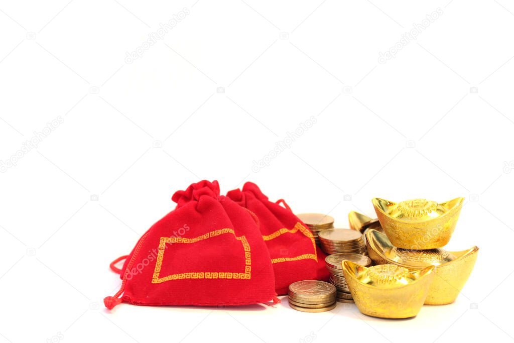 Ancient Chinese golden ingots, gold coins and Chinese lucky red bag on white background, Chinese new year ornament