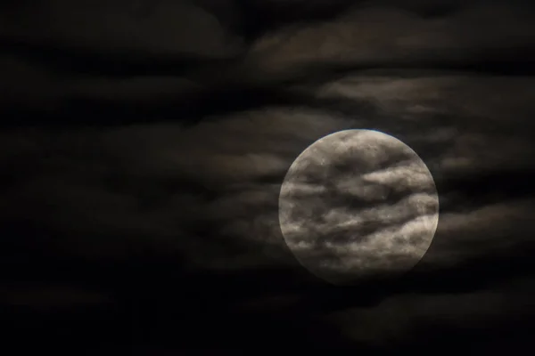 Moon between clouds in Montserrat, Barcelona, Spain