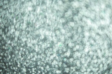 Noel arkaplanı için gümüş parıltı, gümüş bokeh dokusu.