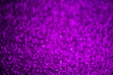 Soyut Noel arkaplanı için mor parıltı, mor bokeh dokusu.