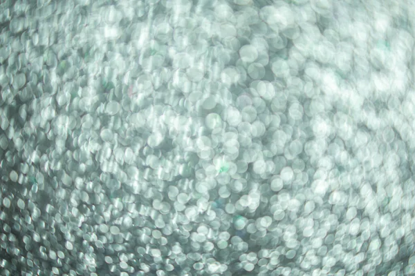 Silver glitter, silver bokeh texture for christmas abstract background.