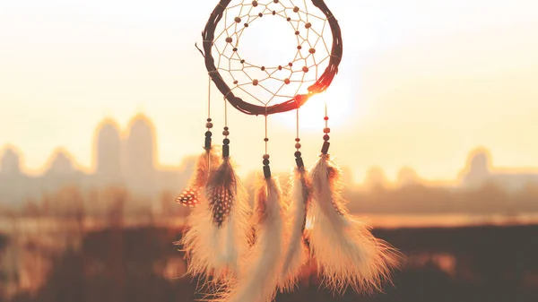 Dream catcher against the sky. City across the river. Far from the bustle of the city. Horizontal photography. — Stock Photo, Image