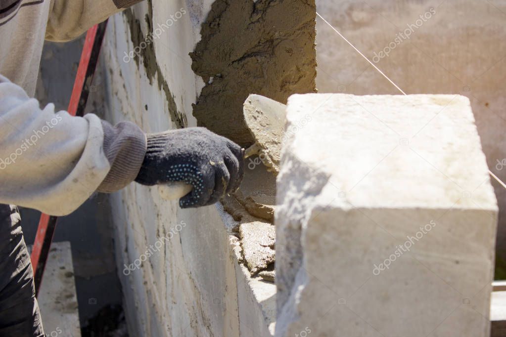 Bricklaying, building a house