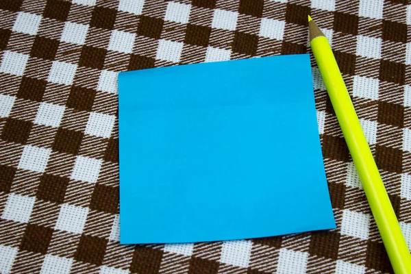 Blue Piece Paper Taking Notes Pencil Table Close Checkered Background — Stock Fotó