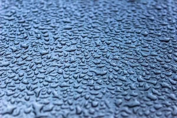 Water drops on painted metal surfaces