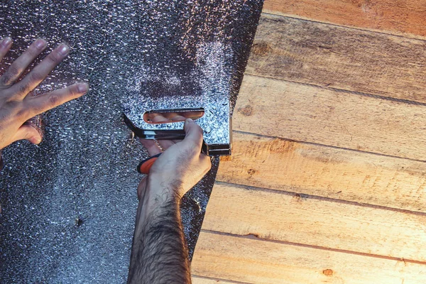 Insulation of the ceiling. builder strengthens the insulation to the ceiling. construction work