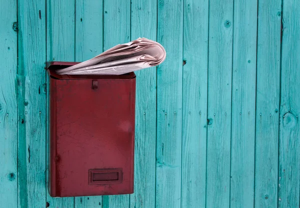 Red Mailbox Overflowing Newspapers Blue Wooden Wall — Free Stock Photo