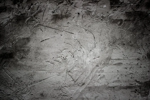 Karanlık bir arka plan üzerinde betonun dokusuna