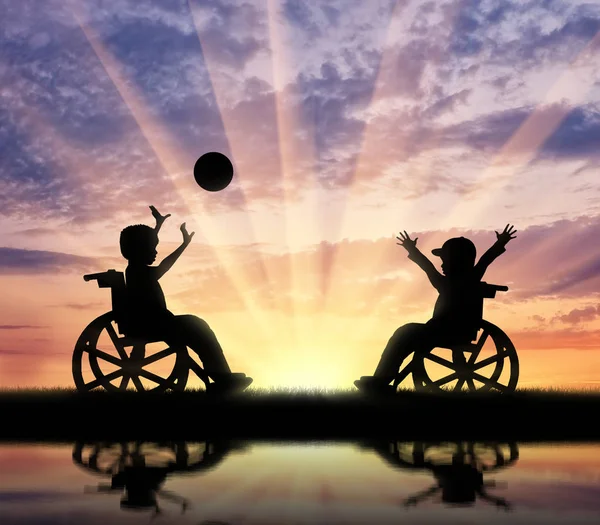 Happy children with disabilities play ball and reflection in river — Stock Photo, Image