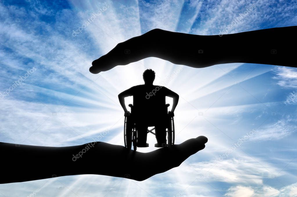 Disabled person in wheelchair in hands day