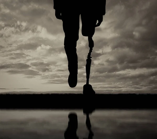 Leg with artificial limb black and white reflection — Stock Photo, Image