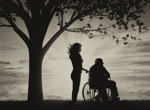 Disabili in sedia a rotelle con infermiera sotto l'albero vicino vedi — Foto Stock