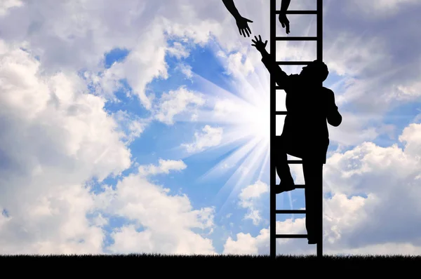 Businessman climbing stairs and a helping hand. — Stock Photo, Image