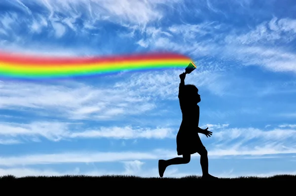 Kind zeichnet einen Regenbogen in den Himmel — Stockfoto