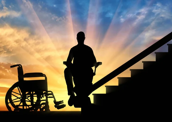 Disabled person sitting on a lift for the disabled — Stock Photo, Image