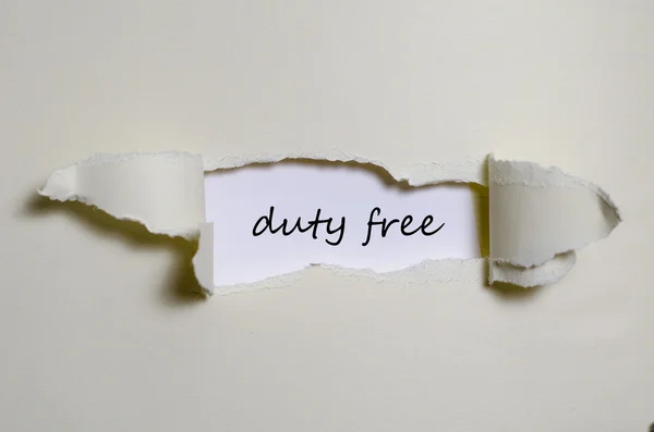 Η λέξη duty free εμφανίζεται πίσω από σκισμένο χαρτί — Φωτογραφία Αρχείου