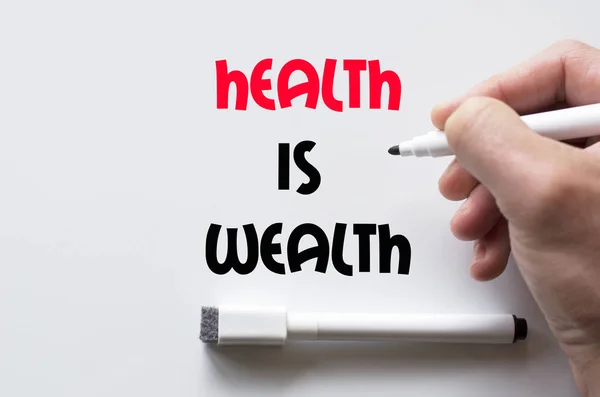 Health is wealth written on whiteboard