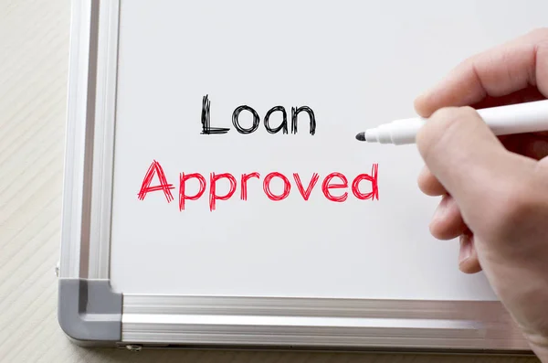 Loan approved written on whiteboard