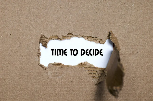 The word time to decide appearing behind torn paper — Stock Photo, Image