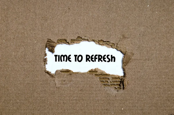 The word time to refresh appearing behind torn paper — Stock Photo, Image