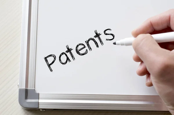 Patente auf Whiteboard geschrieben lizenzfreie Stockbilder