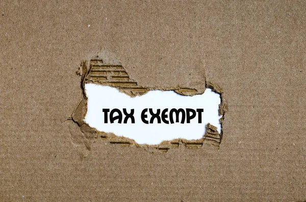 The word tax exempt appearing behind torn paper — Stock Photo, Image