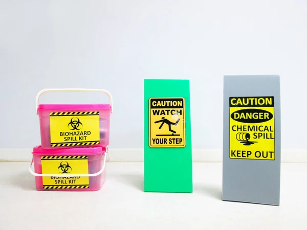 The Biohazard Spill Kit boxes with Warning danger caution Biohazard tag sign or symbol for emergency response situation when the corona virus spill out in medical room, safety first in laboratory.