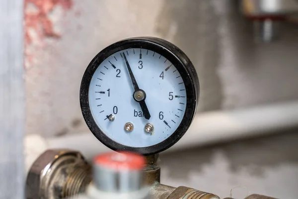 plumbing cabinet. turn off hot or cold water. close-up of a hot or cold water pressure sensor