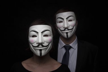 two members of anonymous activist hacker group with mask studio  clipart