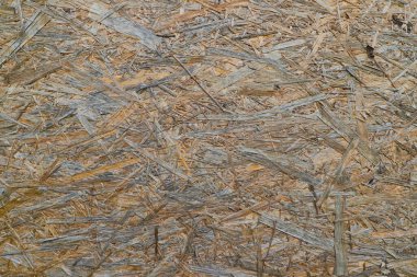 Chipboard 'un doğal arka planı, ahşap parçaları doğal rengi, talaş dokusu.