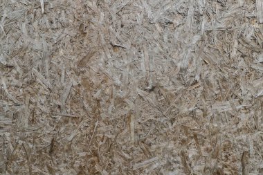 Chipboard 'un doğal arka planı, ahşap parçaları doğal rengi, talaş dokusu.