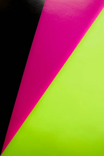 pink light green and black colors in 1 frame of colored paper use as a background