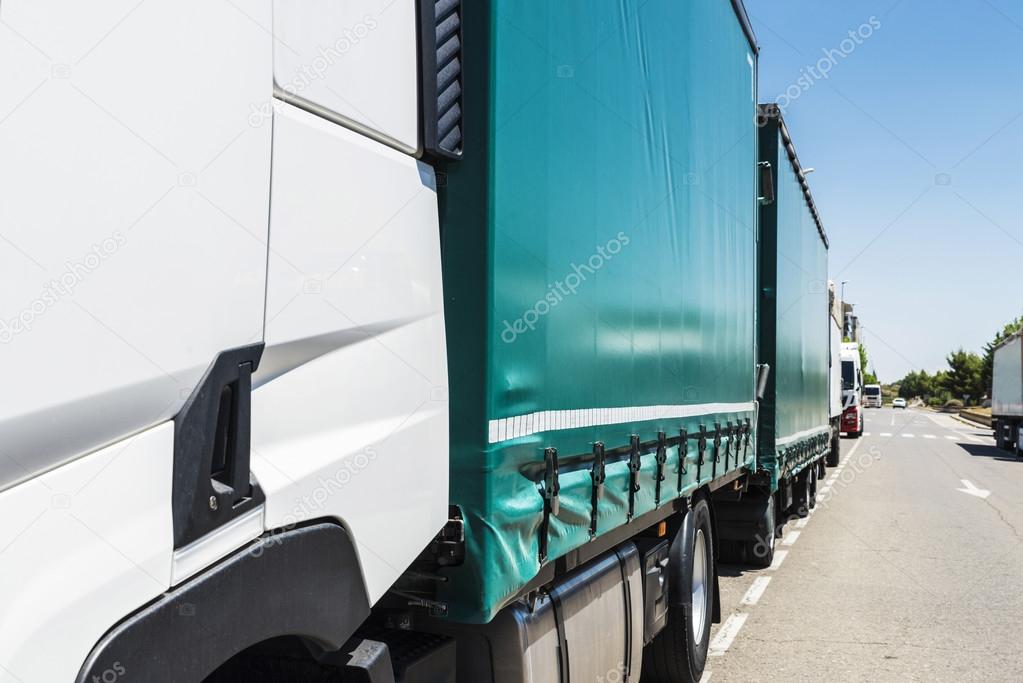 Trucks parked on a street 