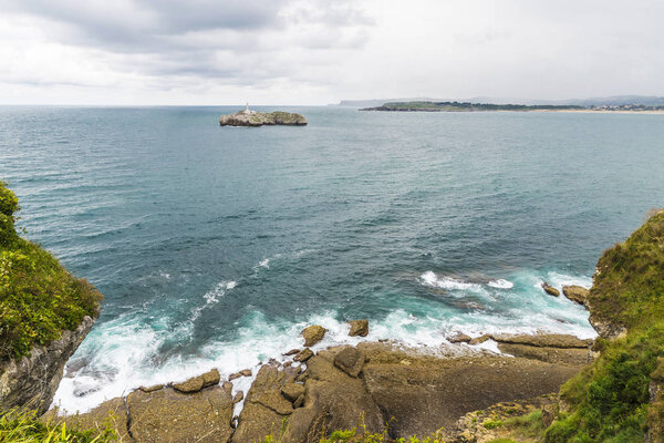Rocky coastline along cliffs in Santander, Spain