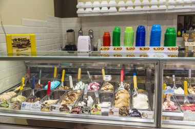 Display of assorted italian ice creams clipart