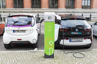 Electric cars recharging the batteries in Berlin, Germany clipart