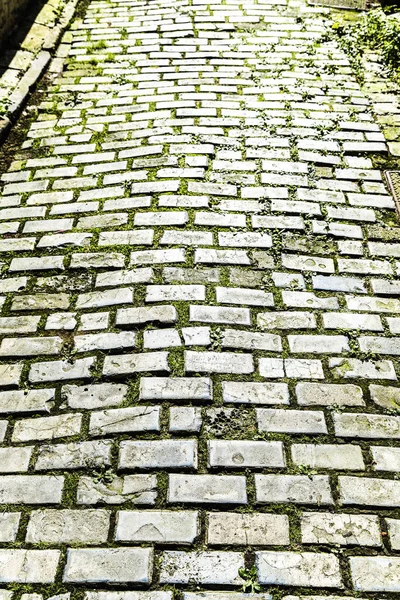 Street with cobblestone floor as background in Bruges, Belgium — Stock Photo, Image