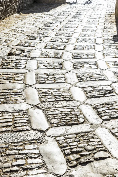 Pedra velha estrada pavimentada como fundo — Fotografia de Stock